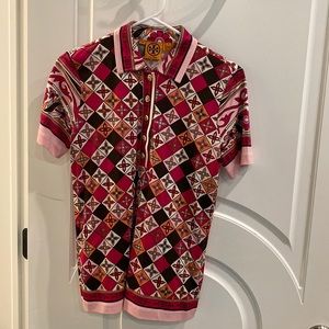 Tory Burch shirt sleeve silk Jersey polo shirt with gold logo buttons.